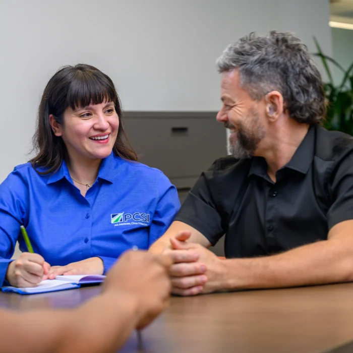 two employees chatting