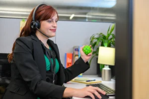 woman holding a pop ball while answering phone calls